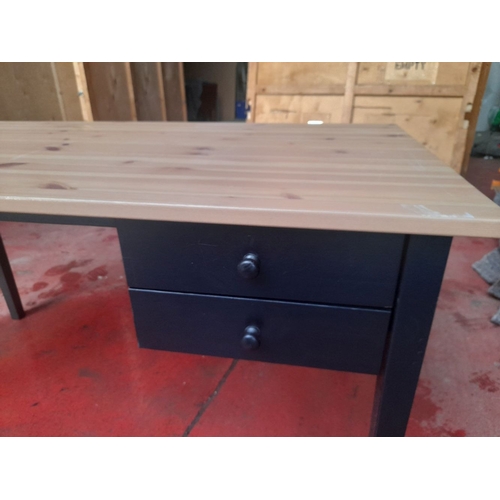 287 - A MODERN DESK, with pine top, black painted base with two drawers, raised on straight leg. Dimension... 