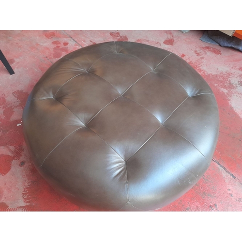 288 - A LARGE LEATHER UPHOLSTERED OTTOMAN, circular form with button upholstery to top. Dimensions: 100cm ... 