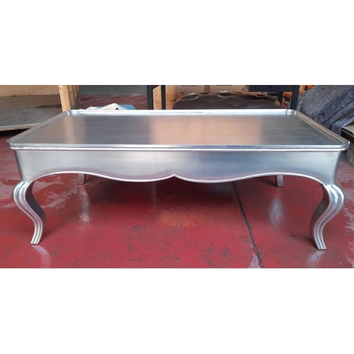 289 - A LARGE SILVER PAINTED COFFEE TABLE, with raised gallery border to top, raised on shaped fluted legs... 