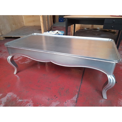 289 - A LARGE SILVER PAINTED COFFEE TABLE, with raised gallery border to top, raised on shaped fluted legs... 