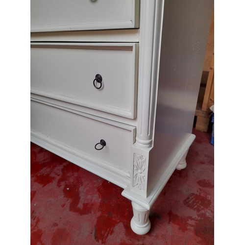 291 - A WHITE PAINTED SIX DRAWER CHEST OF DRAWERS, with three short drawers over three long drawers, all p... 