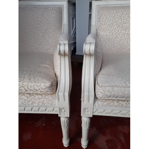 292 - A PAIR OF WHITE PAINTED FRENCH STYLE ARMCHAIRS, with upholstered backrest and seat, carved armrests ... 