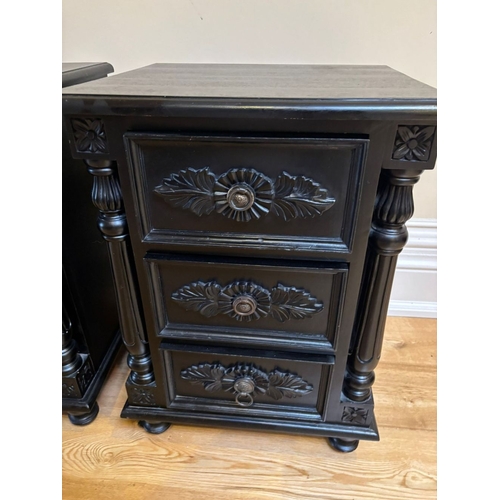 295 - A PAIR OF BLACK PAINTED THREE DRAWER CHESTS/LOCKERS, the three drawers with carvings, as well as flu... 