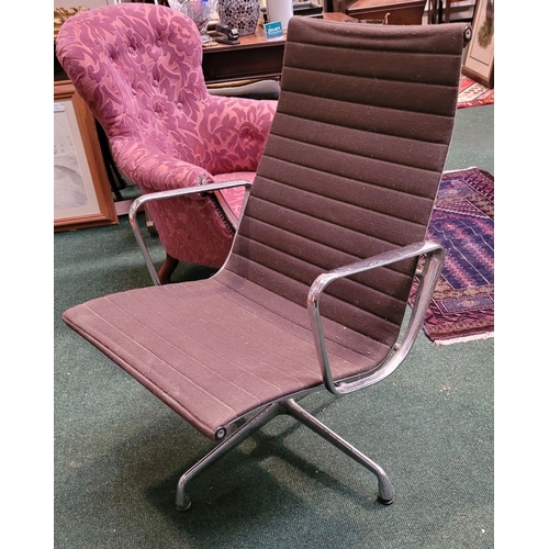 299 - A VINTAGE EAMES ALU CHAIR, with soft brown upholstery, label to the support states: Original Eames A... 