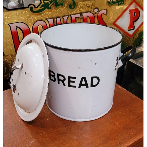 305 - AN ENAMEL BREAD CANISTER, with lid. The front of the tin with BREAD in bold lettering and a pair of ... 