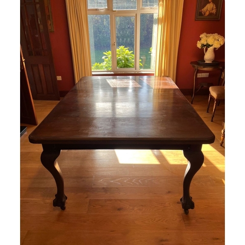 311 - A FINE MAHOGANY DINING TABLE, the top with canted corners, raised on cabriole leg on claw and ball f... 