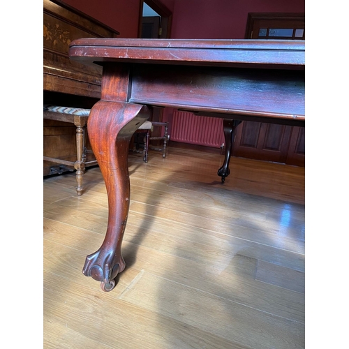 311 - A FINE MAHOGANY DINING TABLE, the top with canted corners, raised on cabriole leg on claw and ball f... 