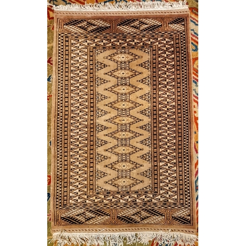 321 - A GOOD QUALITY HANDMADE RUG, possibly Afghan, short white fringe to each end, geometric style patter... 