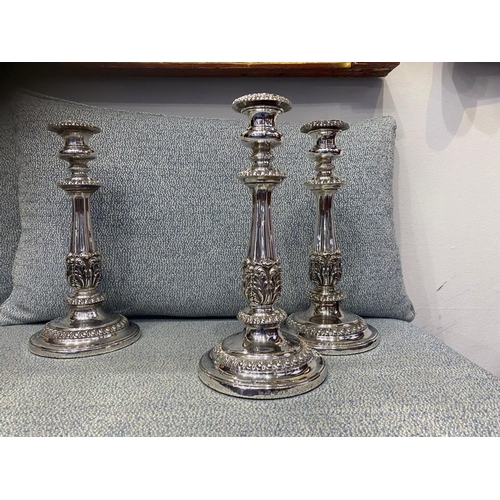 327 - A SET OF FOUR GEORGE IV SILVER CANDLESTICKS, by S Young & Co., Sheffield c.1823. Each features decor... 