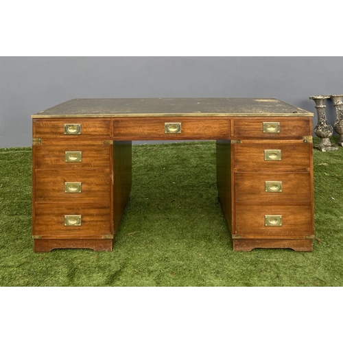 328 - A MAHOGANY MILITARY CAMPAIGN DESK, with tooled leather top, fitted with one long and eight short dra... 