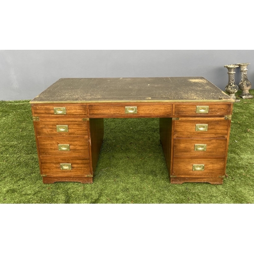 328 - A MAHOGANY MILITARY CAMPAIGN DESK, with tooled leather top, fitted with one long and eight short dra... 