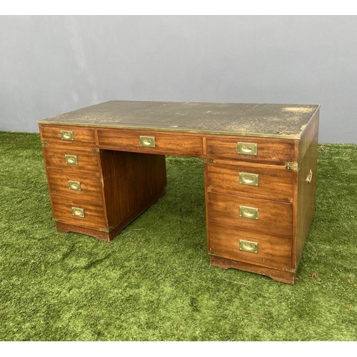 328 - A MAHOGANY MILITARY CAMPAIGN DESK, with tooled leather top, fitted with one long and eight short dra... 