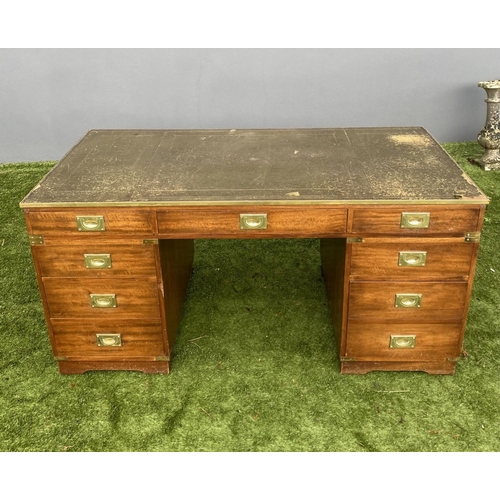 328 - A MAHOGANY MILITARY CAMPAIGN DESK, with tooled leather top, fitted with one long and eight short dra... 