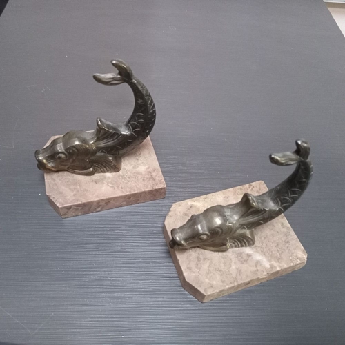 33 - A PAIR OF ART DECO BOOKENDS ON MARBLE BASES, each in the form of a stylised dolphin, the marble base... 