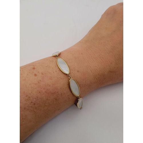 36 - A LOVELY 9CT YELLOW GOLD MOTHER OF PEARL PANEL BRACELET, this piece is really elegant. The beautiful... 