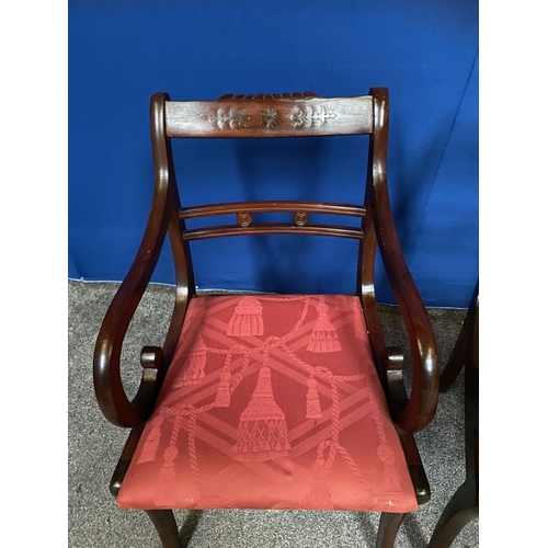 37 - A PAIR OF MAHOGANY REGENCY STYLE CARVER ARMCHAIRS, the backrail with carved foliate details, above f... 