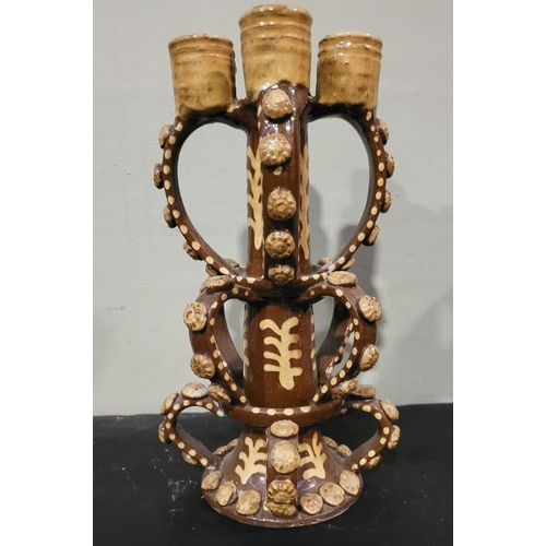 43 - A VINTAGE HAND FORMED & GLAZED CANDELABRA STAND, created in the form of the candlesticks found in Wr... 