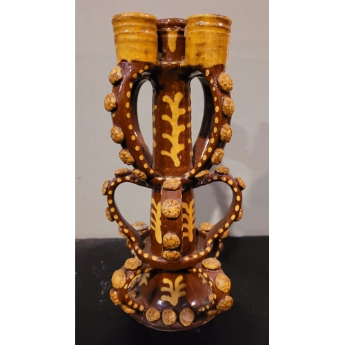 43 - A VINTAGE HAND FORMED & GLAZED CANDELABRA STAND, created in the form of the candlesticks found in Wr... 