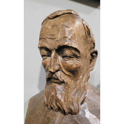 44 - A LARGE CARVED WOODEN BUST OF A BEARDED MAN, the solid piece of wood is carved to the front & sides;... 