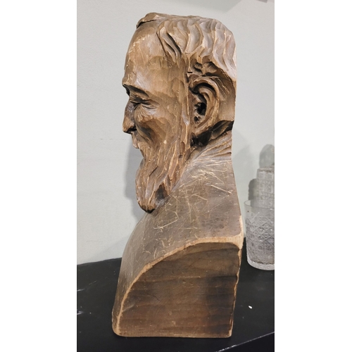 44 - A LARGE CARVED WOODEN BUST OF A BEARDED MAN, the solid piece of wood is carved to the front & sides;... 