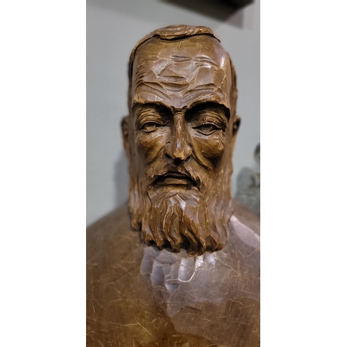 44 - A LARGE CARVED WOODEN BUST OF A BEARDED MAN, the solid piece of wood is carved to the front & sides;... 