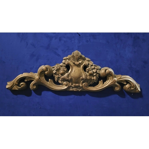 46 - A LARGE HEAVY GILT COLOURED FURNITURE / WALL PEDIMENT PIECE, decorated with a large shield shaped ca... 