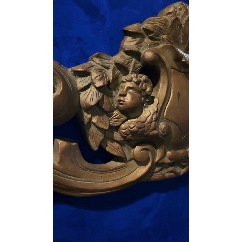 46 - A LARGE HEAVY GILT COLOURED FURNITURE / WALL PEDIMENT PIECE, decorated with a large shield shaped ca... 