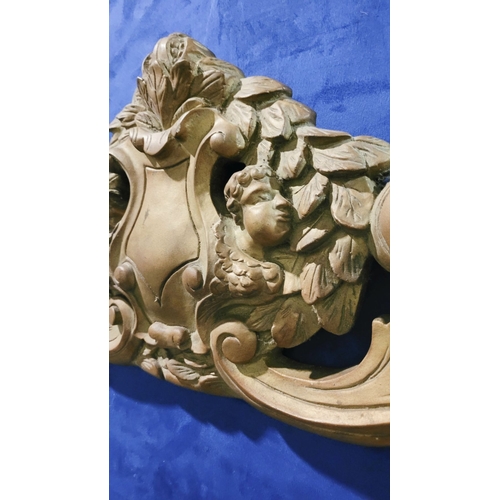 46 - A LARGE HEAVY GILT COLOURED FURNITURE / WALL PEDIMENT PIECE, decorated with a large shield shaped ca... 