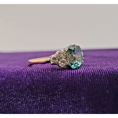 5 - A STUNNING 18CT YELLOW GOLD AQUAMARINE & DIAMOND RING, to the centre is a large emerald cut aquamari... 