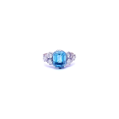 5 - A STUNNING 18CT YELLOW GOLD AQUAMARINE & DIAMOND RING, to the centre is a large emerald cut aquamari... 