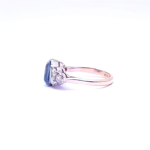 5 - A STUNNING 18CT YELLOW GOLD AQUAMARINE & DIAMOND RING, to the centre is a large emerald cut aquamari... 