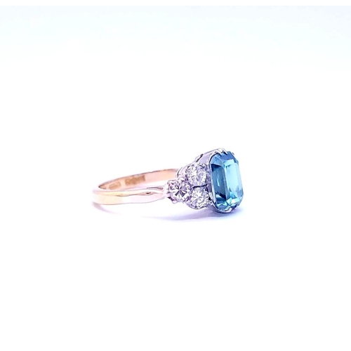 5 - A STUNNING 18CT YELLOW GOLD AQUAMARINE & DIAMOND RING, to the centre is a large emerald cut aquamari... 