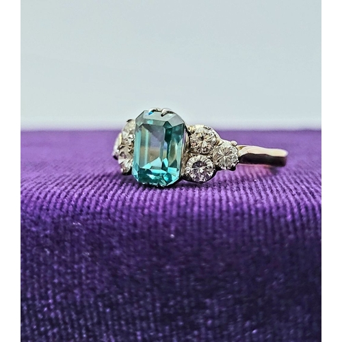 5 - A STUNNING 18CT YELLOW GOLD AQUAMARINE & DIAMOND RING, to the centre is a large emerald cut aquamari... 