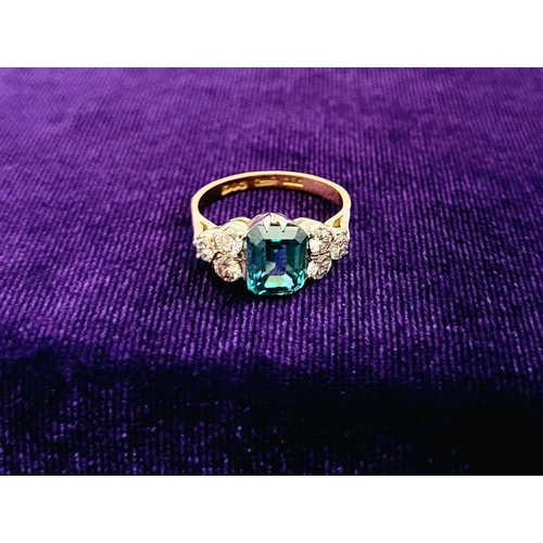 5 - A STUNNING 18CT YELLOW GOLD AQUAMARINE & DIAMOND RING, to the centre is a large emerald cut aquamari... 