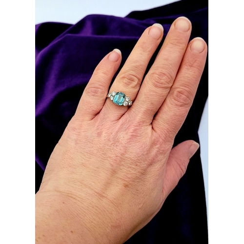 5 - A STUNNING 18CT YELLOW GOLD AQUAMARINE & DIAMOND RING, to the centre is a large emerald cut aquamari... 