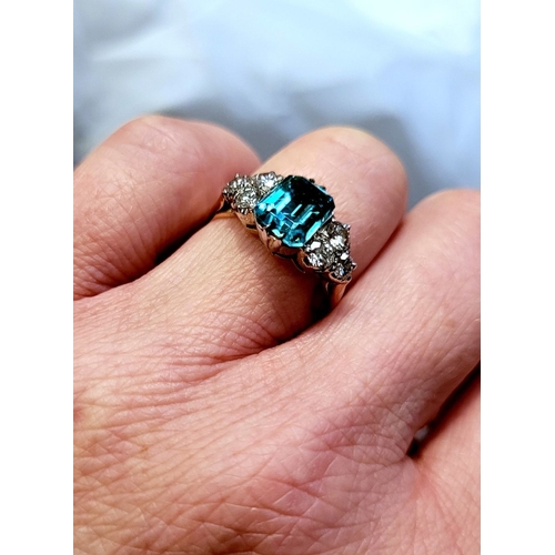 5 - A STUNNING 18CT YELLOW GOLD AQUAMARINE & DIAMOND RING, to the centre is a large emerald cut aquamari... 