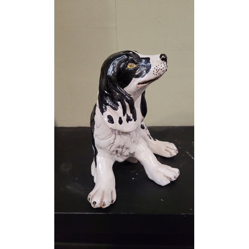 52 - A VINTAGE ITALIAN MADE FIGURINE OF A SPANIEL, signed to the base. P. Marioni, numbered 407. Impresse... 