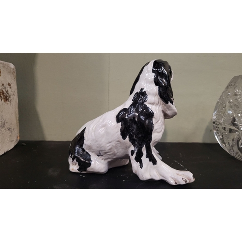 52 - A VINTAGE ITALIAN MADE FIGURINE OF A SPANIEL, signed to the base. P. Marioni, numbered 407. Impresse... 