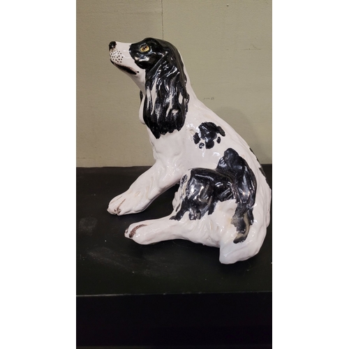 52 - A VINTAGE ITALIAN MADE FIGURINE OF A SPANIEL, signed to the base. P. Marioni, numbered 407. Impresse... 