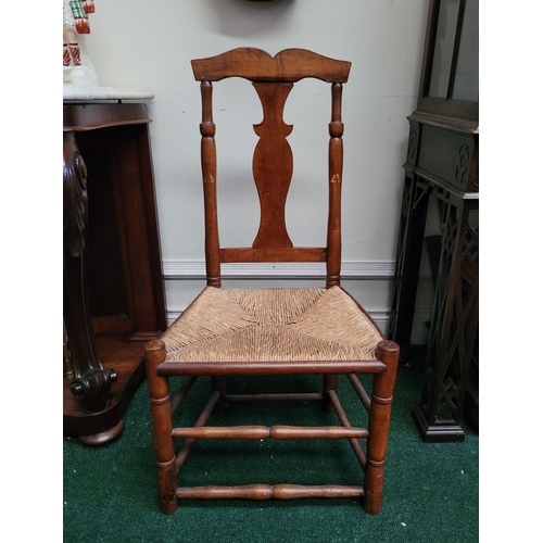 53 - A NEATLY SIZED LOW RISE 18TH CENTURY COUNTRY STYLE QUEEN ANNE CHAIR, with a woven straw/cane seat, t... 