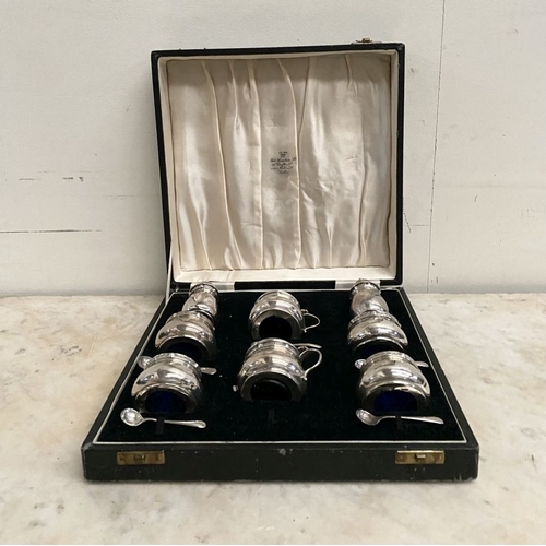 6 - A SILVER DOUBLE CONDIMENT SET IN FITTED CASE BY ‘WEIRS’ OF DUBLIN, to include two castors, two musta... 