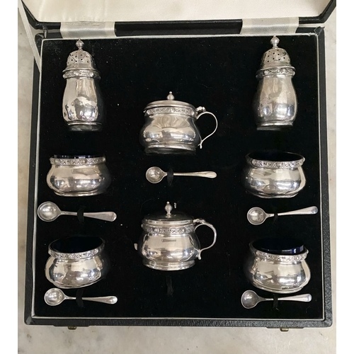 6 - A SILVER DOUBLE CONDIMENT SET IN FITTED CASE BY ‘WEIRS’ OF DUBLIN, to include two castors, two musta... 