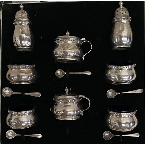 6 - A SILVER DOUBLE CONDIMENT SET IN FITTED CASE BY ‘WEIRS’ OF DUBLIN, to include two castors, two musta... 