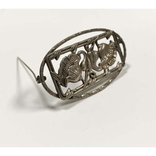 62 - A BEAUTIFUL ART NOUVEAU STERLING SILVER FLOWER BROOCH, featuring two flowers within openwork rectang... 