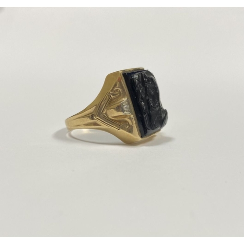 66 - AN EXCELLENT GOLD, DIAMOND & CARVED BLACK ONYX INTAGLIO SIGNET RING, with rectangular carved black o... 