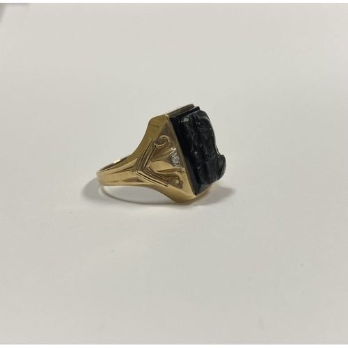 66 - AN EXCELLENT GOLD, DIAMOND & CARVED BLACK ONYX INTAGLIO SIGNET RING, with rectangular carved black o... 