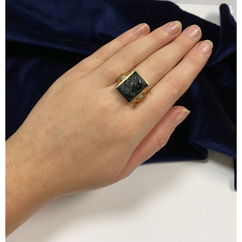 66 - AN EXCELLENT GOLD, DIAMOND & CARVED BLACK ONYX INTAGLIO SIGNET RING, with rectangular carved black o... 