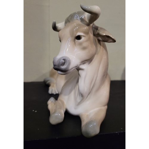 67 - A LARGE LLADRO FIGURINE OF A SEATED OX, beautiful representation of the animal. Maker’s details to t... 