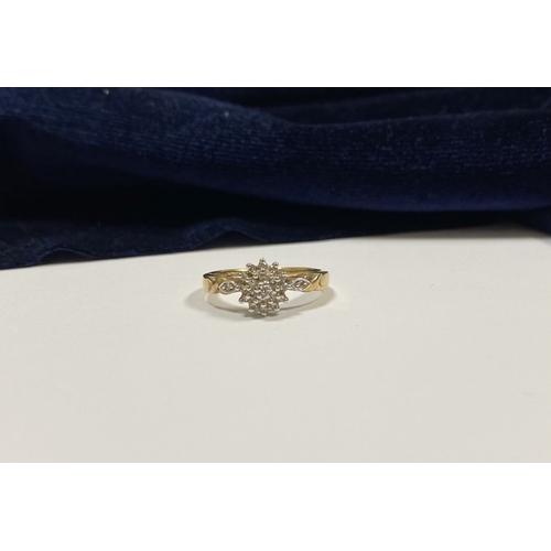 76 - A BEAUTIFUL 9CT YELLOW GOLD DIAMOND CLUSTER RING, with central round cut diamond surrounded by two r... 