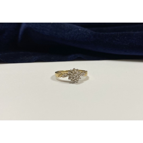 76 - A BEAUTIFUL 9CT YELLOW GOLD DIAMOND CLUSTER RING, with central round cut diamond surrounded by two r... 